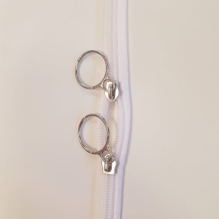 close up image of regular adult white peva u zip body bag zip with twin ring pullers